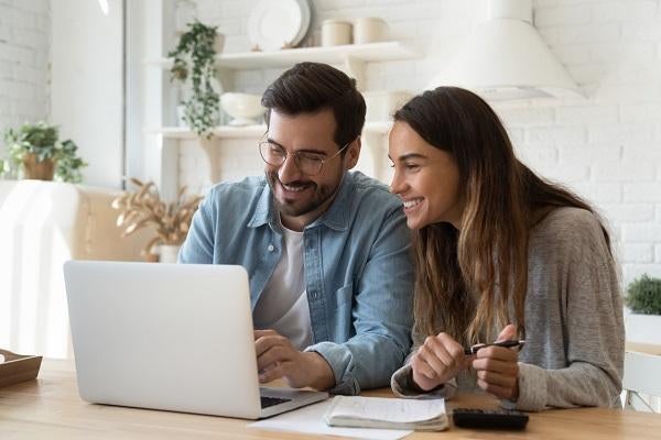 Couple shopping online smiling
